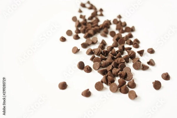 Fototapeta Semi Sweet Chocolate Chips isolated on white background close up.Selective focus.  Top view. Copy space