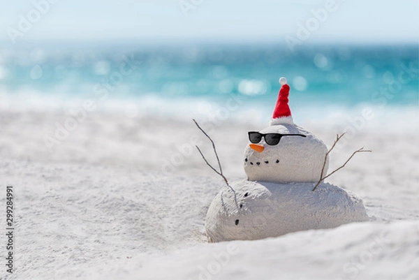 Obraz Christmas Sandy Snowman on a beautiful sand beach - Christmas symbol of countries where the weather is always warm