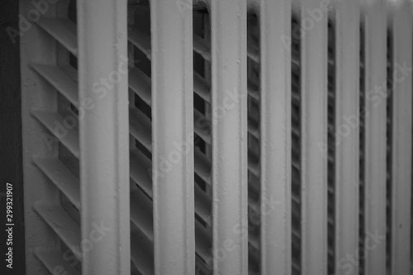 Fototapeta old cast iron radiator, central heating, close-up.