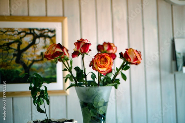 Fototapeta Roses in a vase on the bedside table