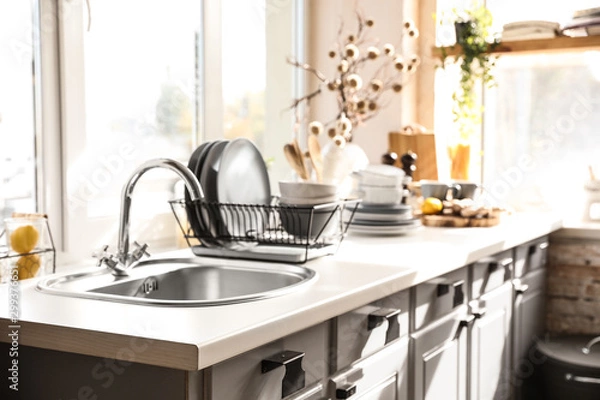 Obraz Stylish kitchen with sink and clean dishware