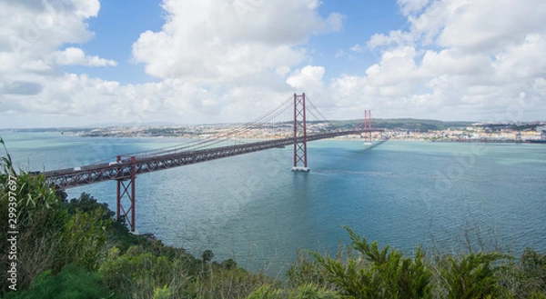 Fototapeta Stunning pictures of the Ponte 25 de Abril bridge - Over 2km-long, this striking Golden Gate-style bridge links Lisbon with Almada in Portugal. 