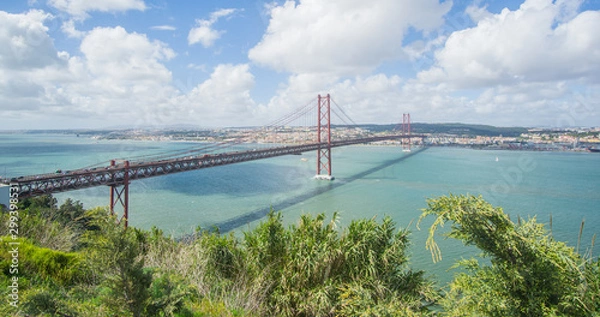 Fototapeta Stunning pictures of the Ponte 25 de Abril bridge - Over 2km-long, this striking Golden Gate-style bridge links Lisbon with Almada in Portugal. 