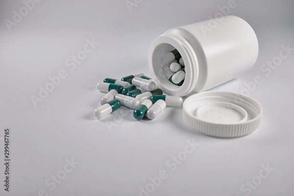 Obraz pills and bottle on white background