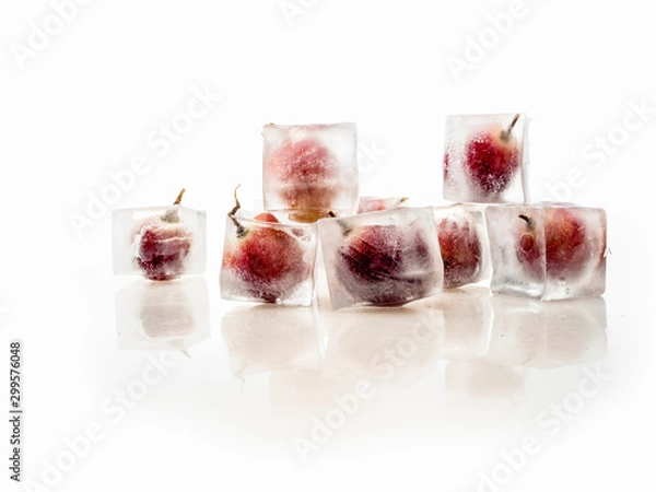 Obraz Grape inside ice on white background