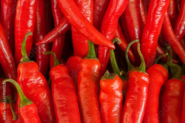 Fototapeta Red pepper for salad lies on the window of a market, store, supermarket