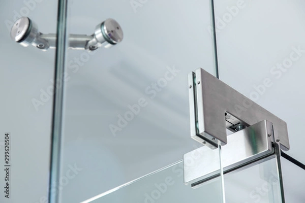 Obraz glass door pivot hinge fittings, close up.