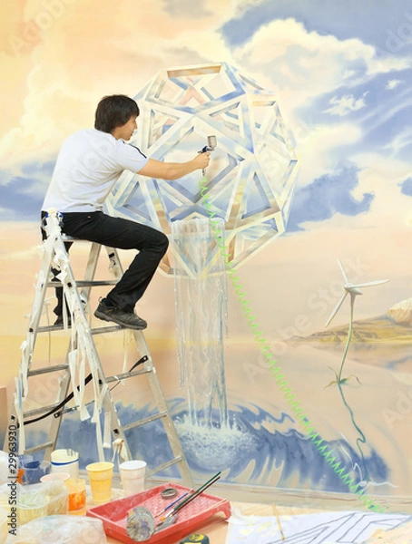 Obraz The artist works with a spray gun on the wall.