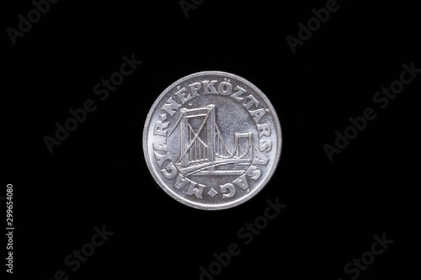 Fototapeta Old Hungarian 50 Filler coin from 1985, obverse showing Elisabeth Bridge in Budapest. Isolated on black background
