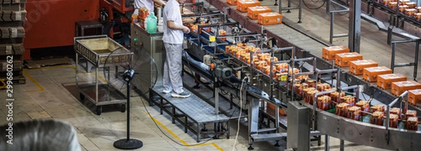 Fototapeta Carbonated drinks factory with view of production and bottles.