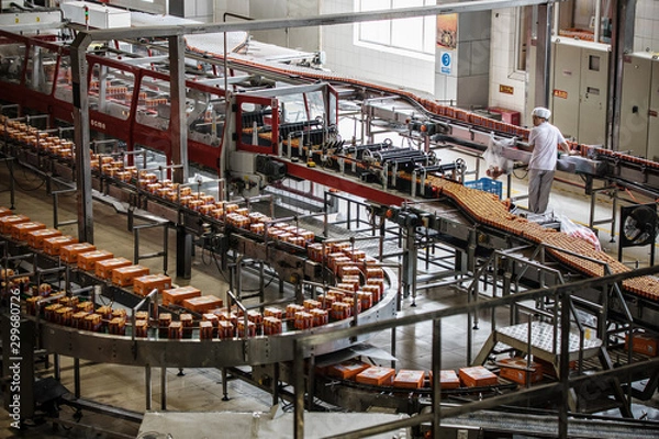 Fototapeta Carbonated drinks factory with view of production and bottles.