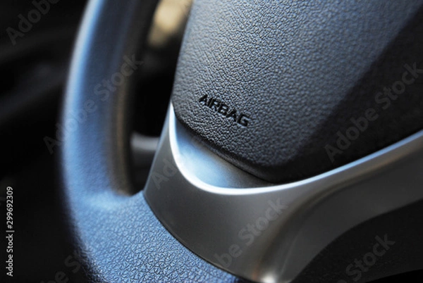 Obraz Airbag icon on steering wheel of car close up