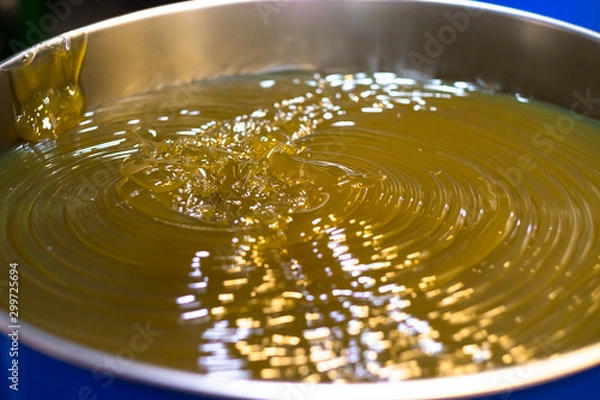 Fototapeta Lubricant of grease (Lithium normal NLGI 3). Yellow appearance in the blue drum. The high viscosity of grease which used in industrial (machine, equipment) and automotive (wheel bearing). 