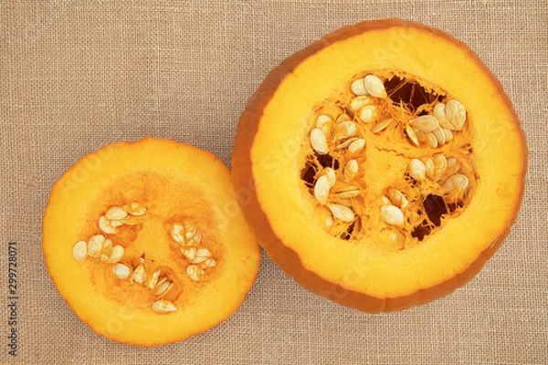 Obraz Focus stacked image of a pumpkin with top cut off, displayed on hessian background shot from above