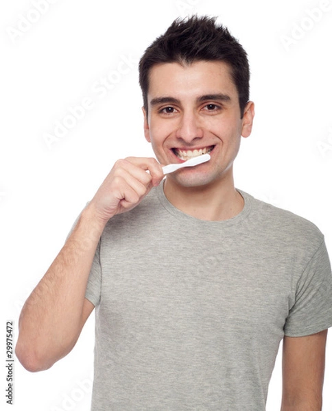 Fototapeta Young man brushing teeth