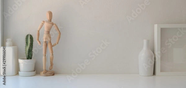 Obraz Minimal office room with mock up frame and decorations on white wooden table and white wall