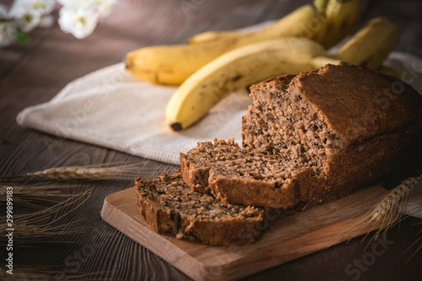 Fototapeta Fresh banana bread on rustic background