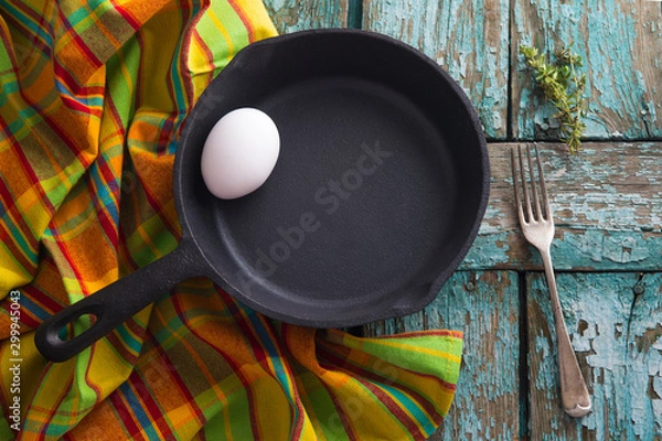Obraz iron pan with egg and towel