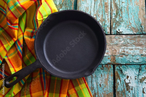 Obraz Iron pan on old wooden table