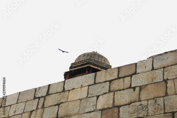 Obraz top of old southeast Asian architecture with bird