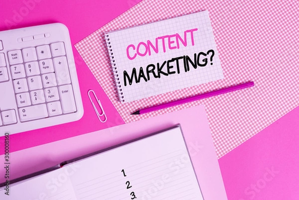 Obraz Writing note showing Content Marketing question. Business concept for involves creation and sharing of online material Writing equipments and computer stuffs placed above colored plain table