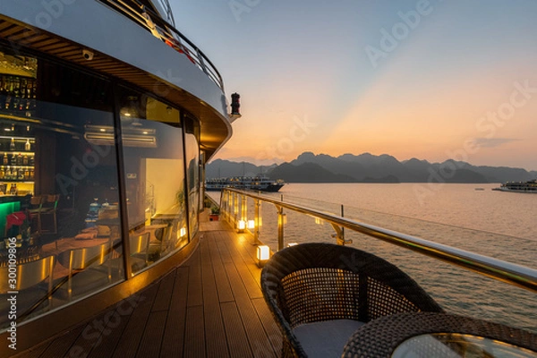 Obraz 5 Star luxury on new modern Cruise Ships on Ha Long Bay, Vietnam looking over the stunning limestone rocks at Sunset