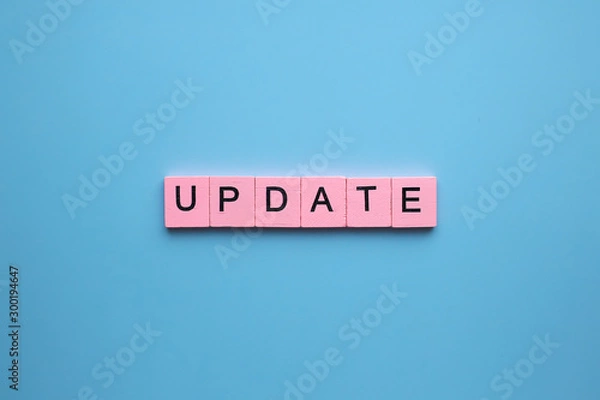Obraz Update word wooden cubes on blue background