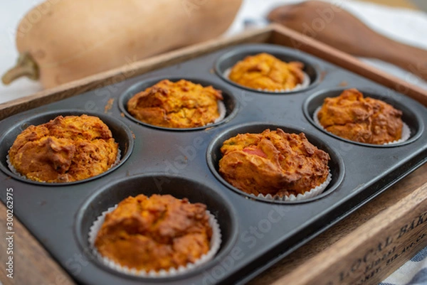 Fototapeta Home made Autumn Pumpkin Spice Muffins on a table
