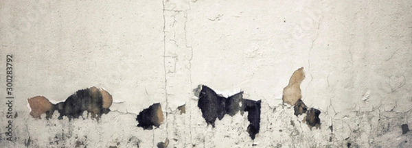 Obraz Old Wall with Moldy Peeling White Painting from Humidity. Cracked White Wall as Rusty Concrete Weathered Wall Grunge Background or Abstract Backdrop Wallpaper Vintage Texture Design Copy Space Text