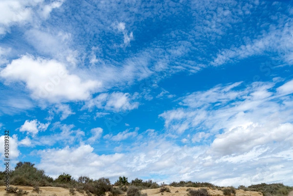 Fototapeta Spring sky with clouds above the badlands Bardenas Reales in the southeast of Navarre