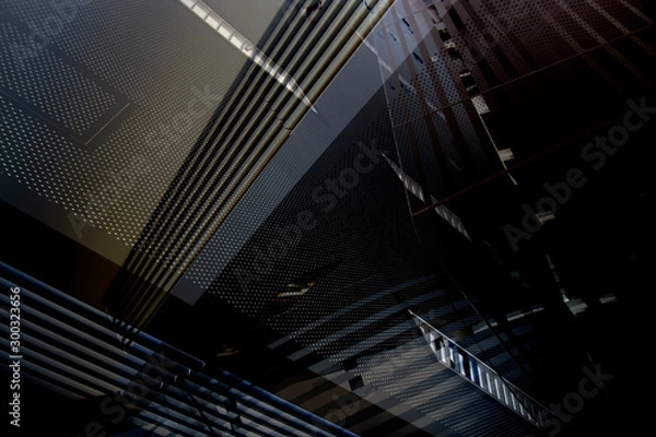 Obraz Kolaż fotografii nowoczesnej architektury biurowej w ciemności. Ogólne elementy architektoniczne. Grunge struktura wnętrza budynku z listwami sufitowymi i perforowanymi panelami metalowymi.