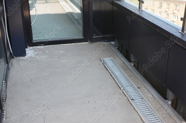 Fototapeta Balcony floor drainage system under construction. House balcony drain
