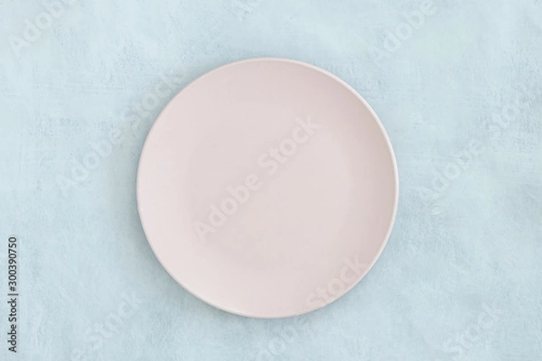 Fototapeta Empty black plate on dark stone background.