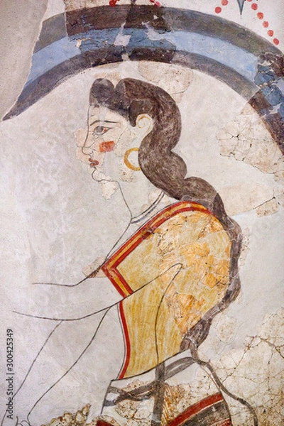 Obraz Wall painting of the ancient House of the Ladies depicting a female figure from Minoan Settlement of Akrotiri, located on the Santorini island, Cyclades, Greece