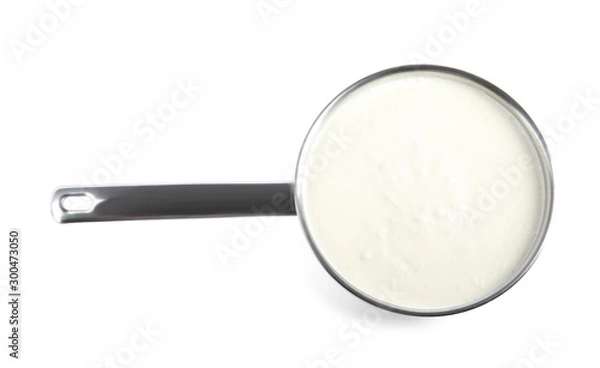 Fototapeta Delicious creamy sauce in pan on white background, top view