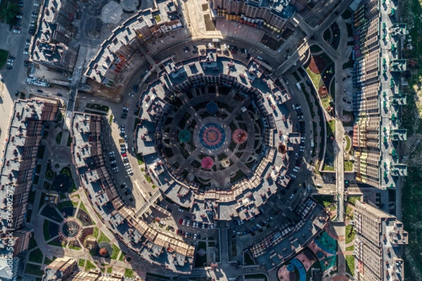 Fototapeta Big city, aerial view. Buildings are built in the form of closed rings.