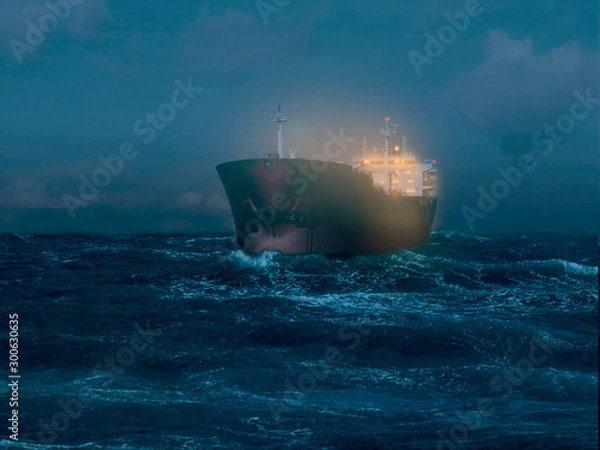 Fototapeta Illuminated tanker on the sea during the night