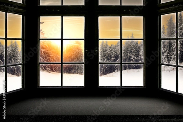 Fototapeta Table top with big window background and beautiful snowy winter landscape outside. Sunny winter day.