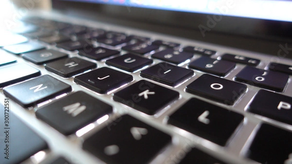 Fototapeta Photography close up shot of used laptop computer or notebook keyboard keys