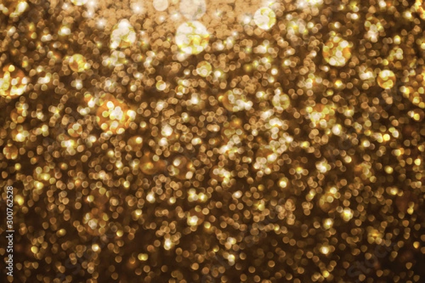 Obraz Abstract gold glitter lights background. defocused