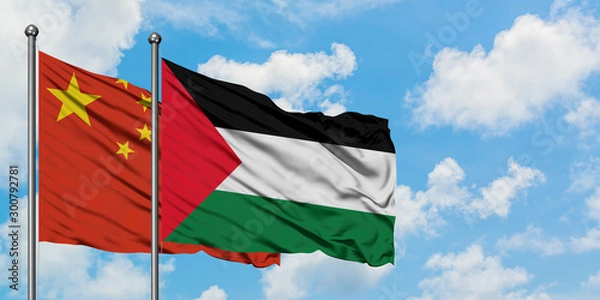 Fototapeta China and Palestine flag waving in the wind against white cloudy blue sky together. Diplomacy concept, international relations.