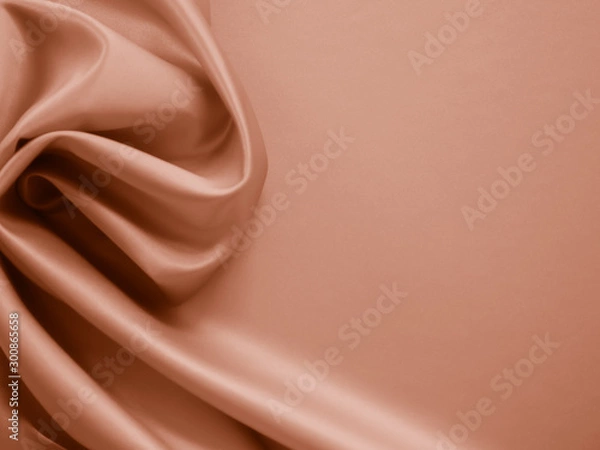 Fototapeta Beautiful smooth elegant wavy beige / light brown satin silk luxury cloth fabric texture, abstract background design. Copy space.