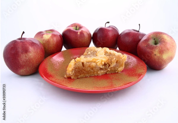 Fototapeta Apple Pie-slice on a plate with cinnamon and some red apples