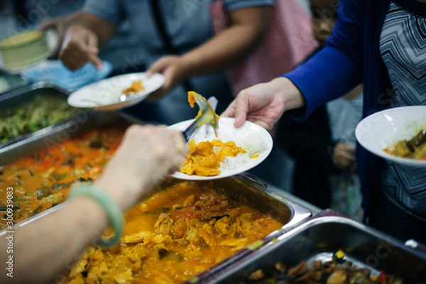 Fototapeta The problem of food shortage in human society: feeding to hungry people: the concept of starvation