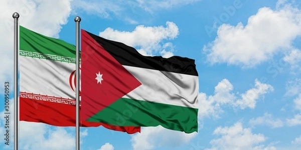 Obraz Iran and Jordan flag waving in the wind against white cloudy blue sky together. Diplomacy concept, international relations.