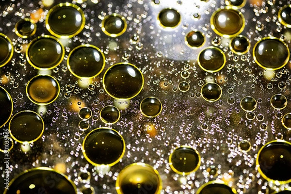 Fototapeta Golden oil bubbles macro on water black background with bokeh fifty megapixels prints