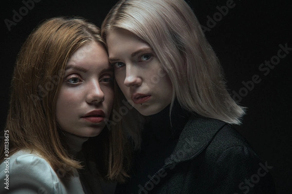 Obraz Two business women in business suits as confrontation of two companies.