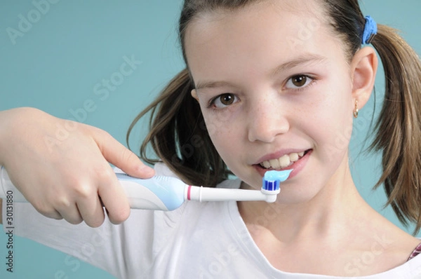 Fototapeta adolescent washing teeth with toothpaste