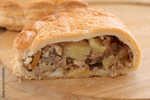 Obraz Traditional English Cornish pasty filled with meat potatoes and swede