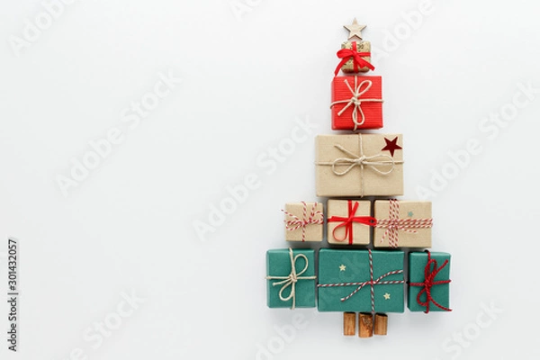 Fototapeta Christmas composition. Gift tree top view background with copy space for your text. Flat lay.